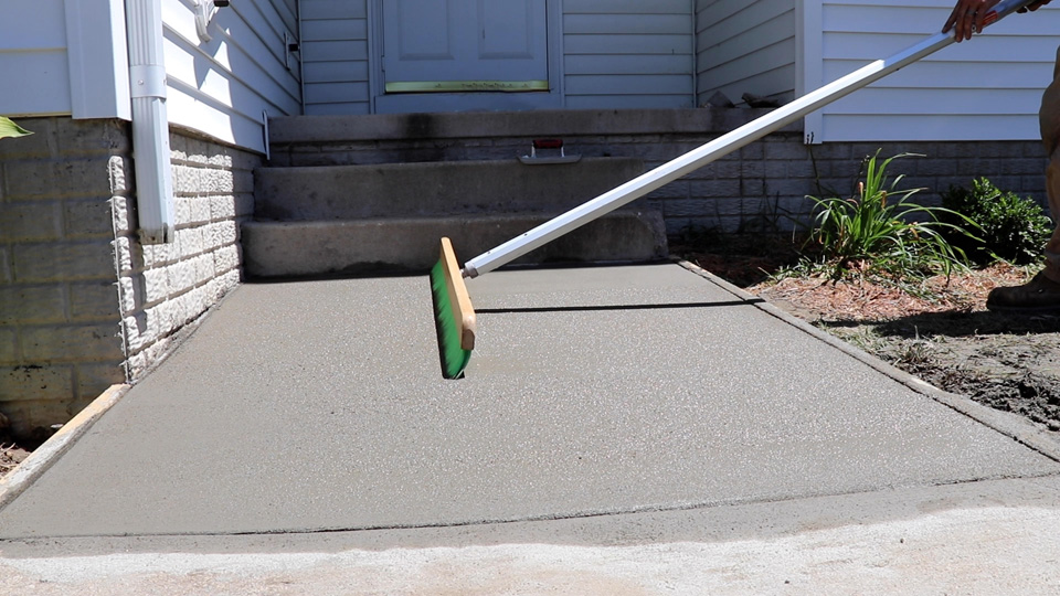 creating a non-slip finish with a green nylon concrete broom